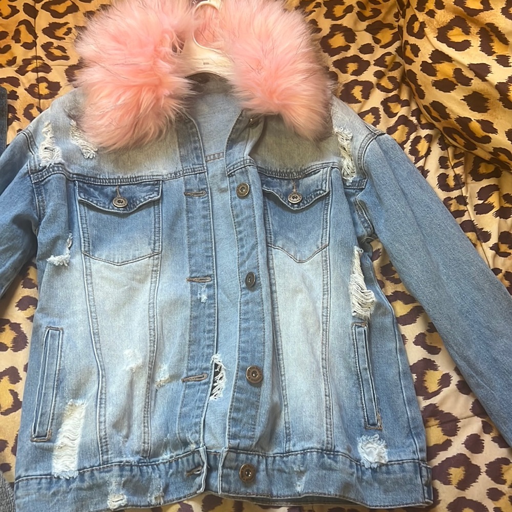 Jean jacket with pink for the rim I have cuts in the denim jacket